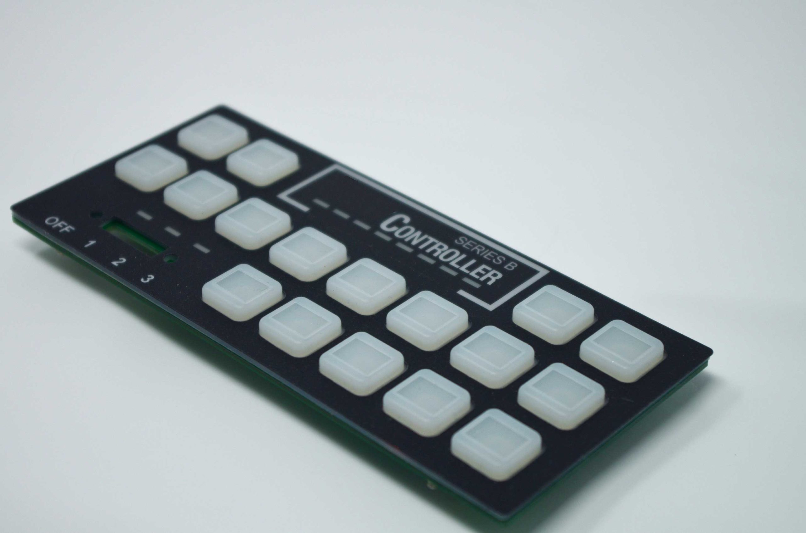 Molded rubber keypad: PCB based with domes and backlit keys on the front side of the PCB; rear of PCB is loaded with all of the customer's electronics; hardware mounted to PCB for assembly.