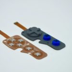 Molded rubber keypad: copper flex circuit based with domes . Side by side view of the FPC and the complete assembly.