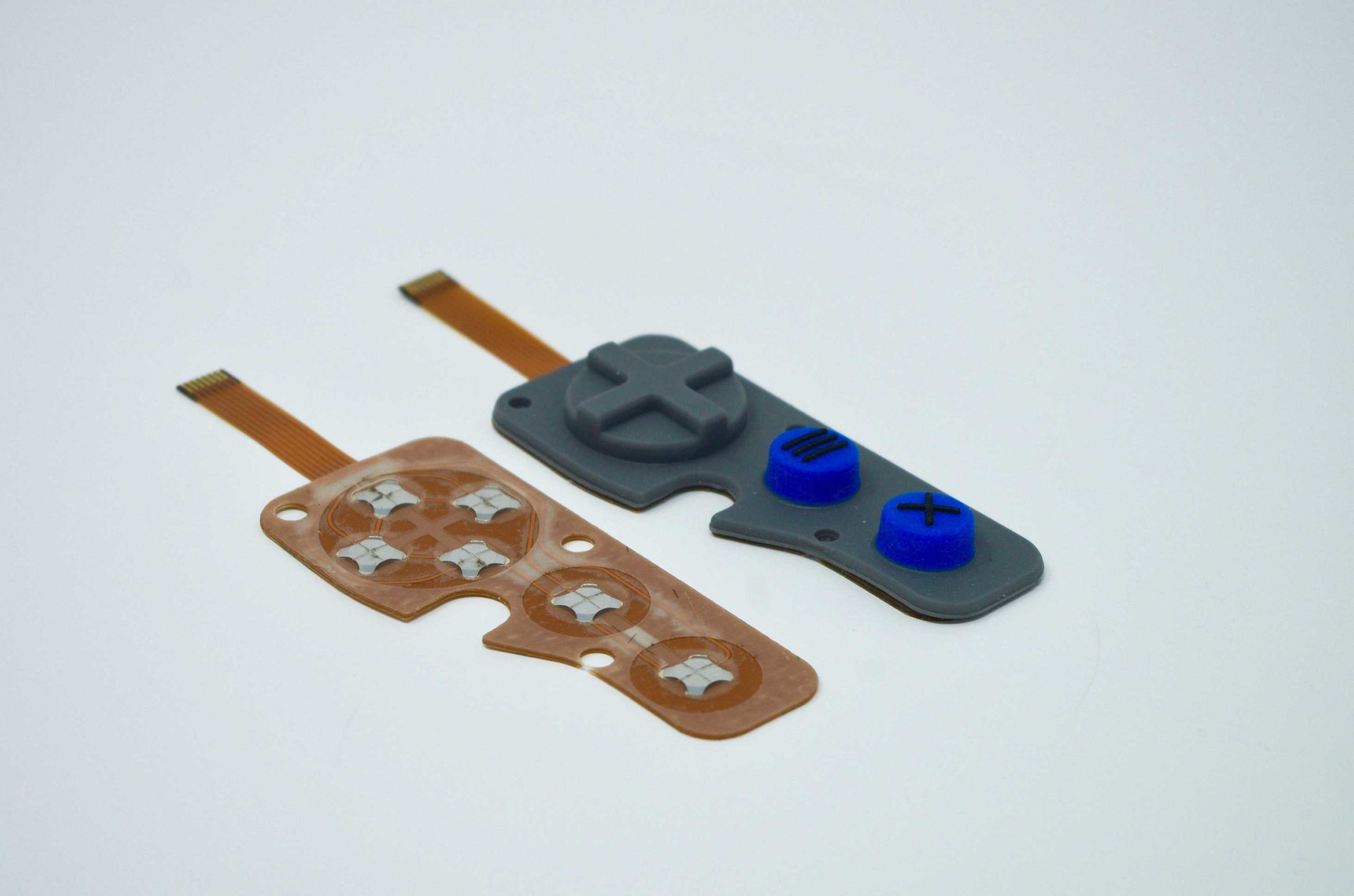 Molded rubber keypad: copper flex circuit based with domes . Side by side view of the FPC and the complete assembly.